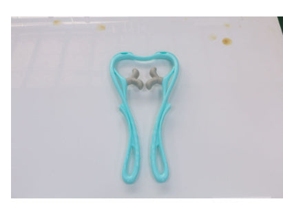 Woman relaxing with blue neck roller massager