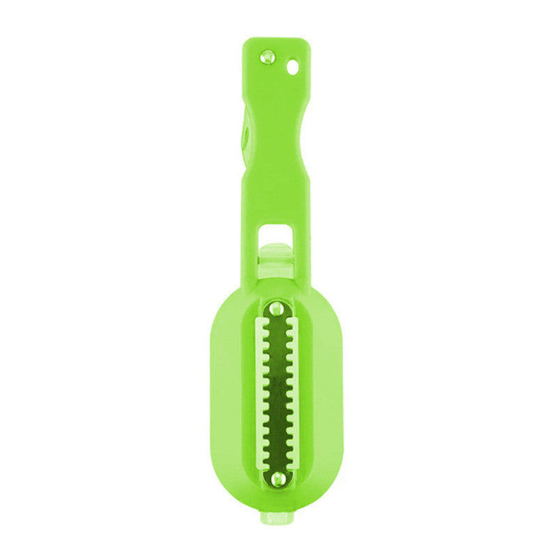 Fish descaling tool in hand