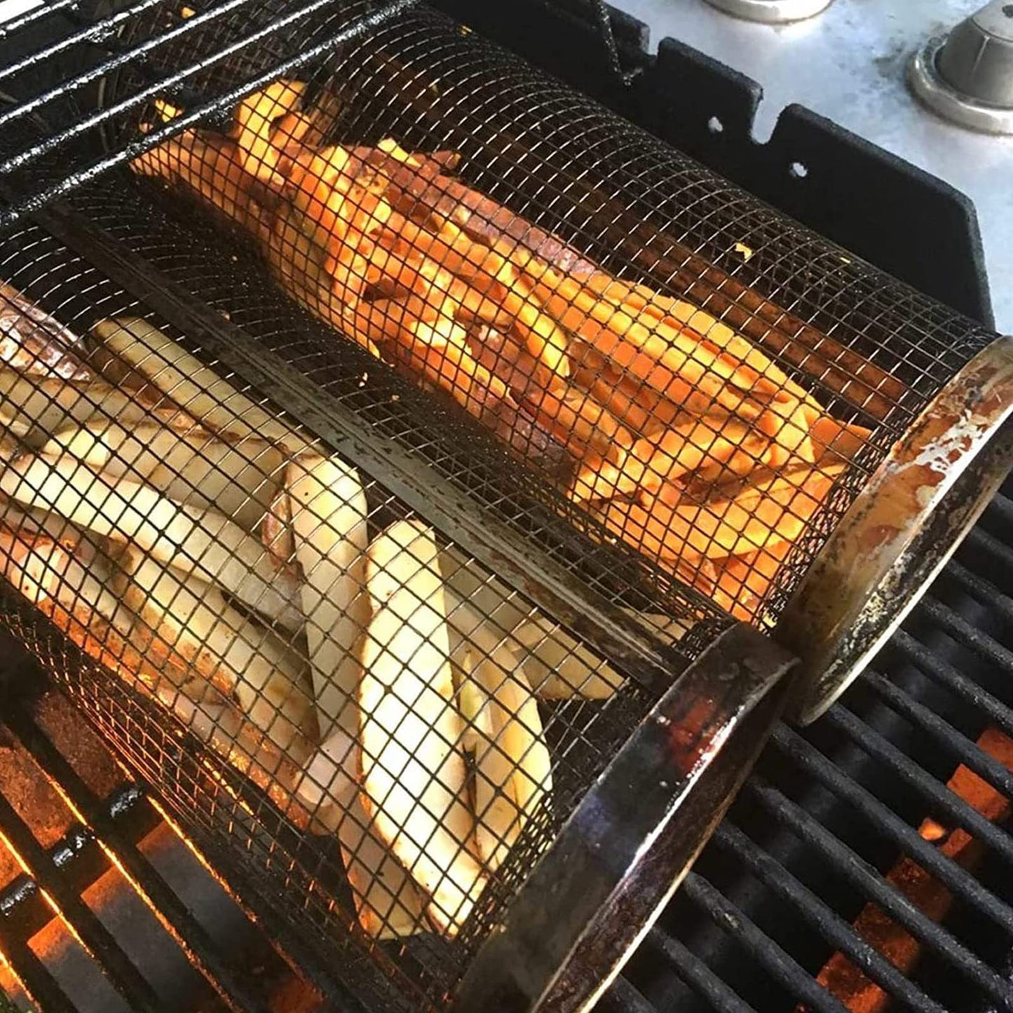 stainless steel grill basket on outdoor fire
