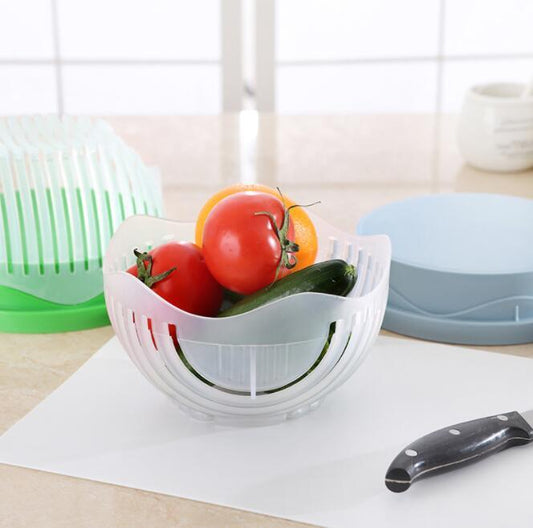 Hands slicing vegetables in bowl

