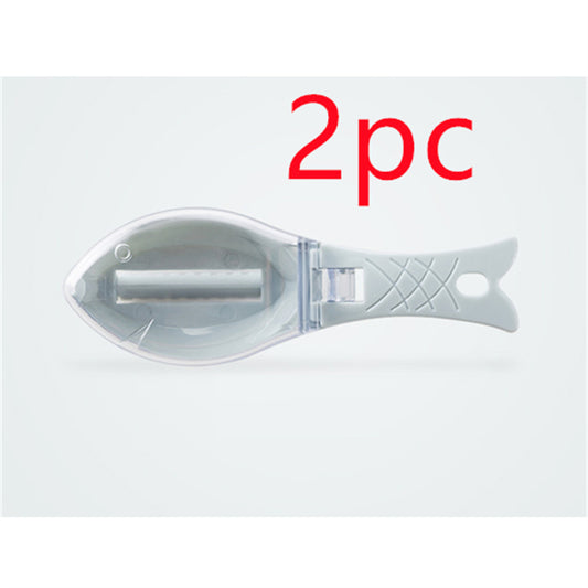 Hand holding fish scale remover

